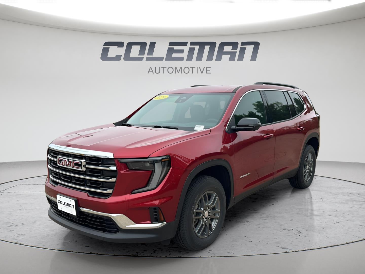 2026 GMC Acadia Elevation in Volcanic Red Tintcoat — front three-quarter view