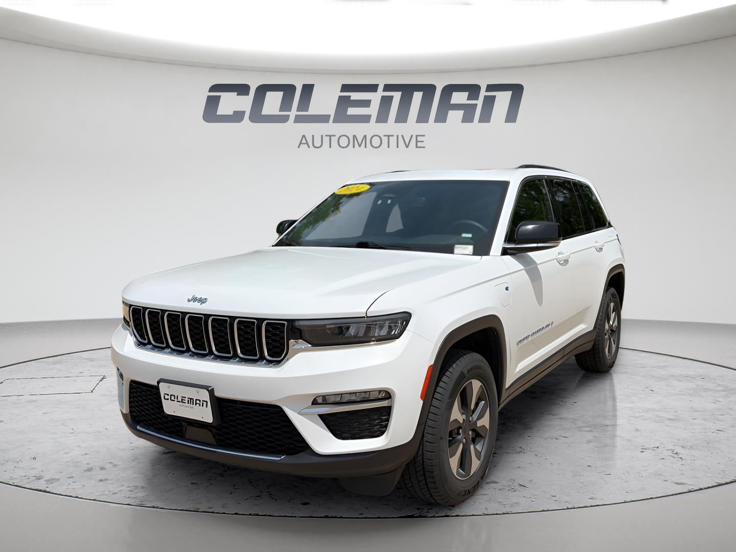 2024 Jeep Grand Cherokee 4xe 4x4 in Bright White Clearcoat — front three-quarter view